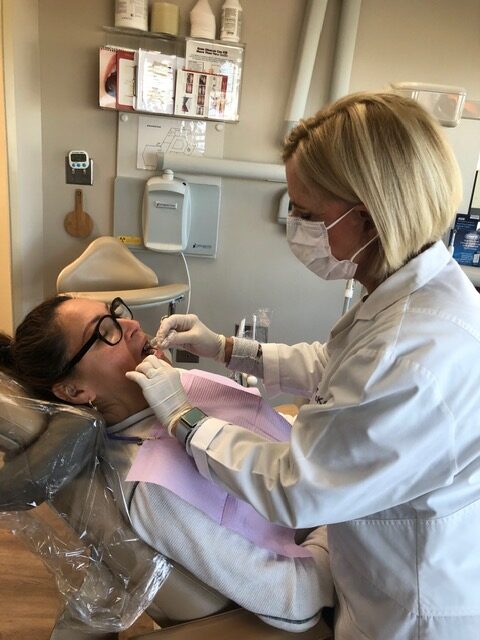 Dr. Jayne McKay working on a patient